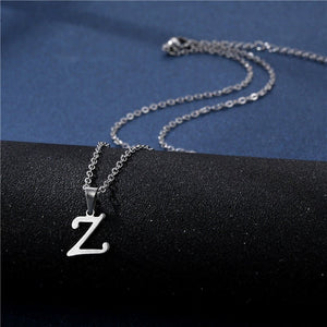 Silver necklace with a 'Z' pendant on a black and blue background