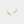 Gold leaf-shaped earrings on a light beige background