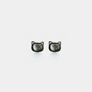 Cat-shaped earrings on a white background