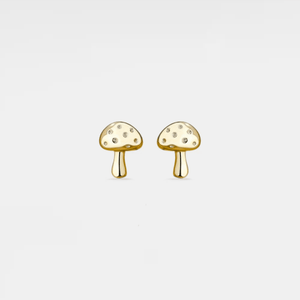 Gold mushroom-shaped earrings on a light beige background