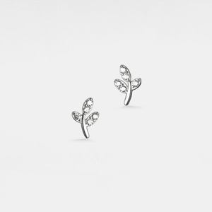 A pair of gold-plated stud earrings featuring a small leaf design, adorned with cubic zirconia.