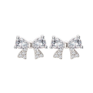 A set of bow tie stud earrings in silver colors, made with sterling silver and cubic zirconia, displayed against a white background.