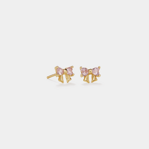 Gold earrings with pink gemstones on a white background