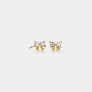 Gold stud earrings with clear gemstones on a white background