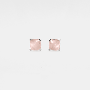 Pair of pink stud earrings on a light gray background
