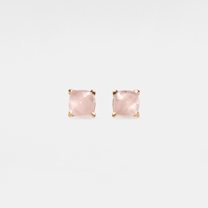 Pair of rose gold square stud earrings on a white background