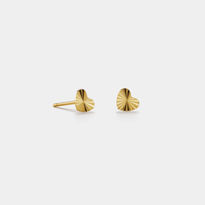 Pair of gold stud earrings on a white background