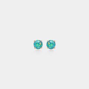 Pair of opal stud earrings on a light gray background