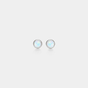 Pair of round opal earrings on a light gray background