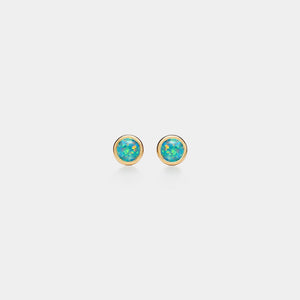 Pair of gold earrings with turquoise stones on a white background