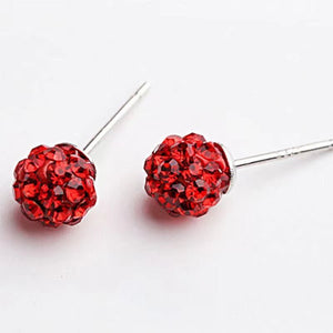 Red crystal stud earrings on a white background