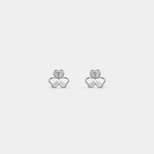 Pair of silver shamrock earrings on a light gray background