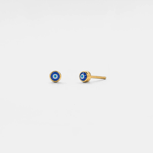 Gold earrings with blue and black eye design on a light gray background