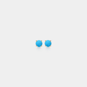 Pair of turquoise stud earrings on a light gray background
