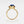 A gold-colored statement cocktail ring with a blue enamel evil eye design on a white background.