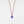 Evil eye pendant on a red string against a white background