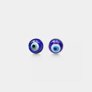 Pair of blue eye-shaped earrings on a white background
