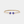 Gold bracelet with blue evil eye charms on a white background