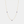 Gold necklace with blue evil eye charms on a white background