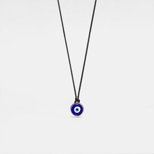 Necklace with a blue evil eye pendant on a white background