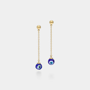 Gold chain earrings with blue evil eye charms on a white background