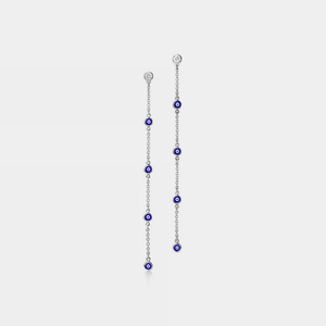 A pair of long drop earrings featuring blue enamel and cubic zirconia beads on gold-plated chains.