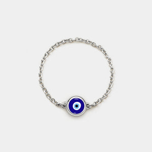 Silver chain ring with a blue evil eye charm on a white background