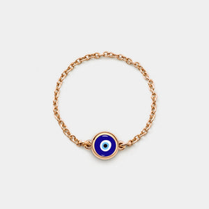 Rose gold chain ring with a blue evil eye charm on a white background