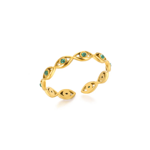 Gold evil eye ring with green gemstones on a white background