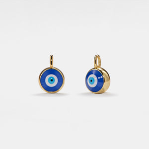 Pair of gold earrings with blue evil eye design on a white background