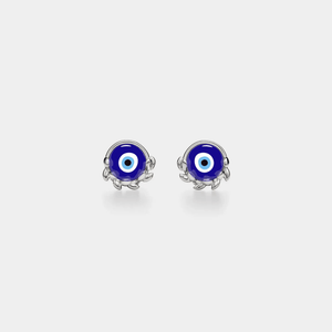 A pair of gold-plated sterling silver stud earrings featuring a blue enamel evil eye design, with intricate leaf patterns around the edge.