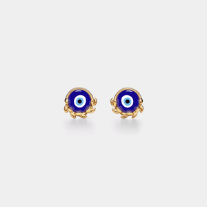Pair of gold and blue evil eye earrings on a white background