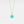 Gold necklace with a turquoise locket on a light gray background