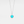 Silver necklace with a turquoise locket on a light gray background