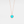 Rose gold necklace with a turquoise locket on a light gray background