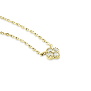 Gold necklace with a diamond pendant on a white background