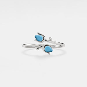 A gold-plated sterling silver ring with natural turquoise stones designed to resemble tulip flowers, with an adjustable band.