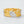 Gold and silver leaf-shaped bracelet on a light gray background