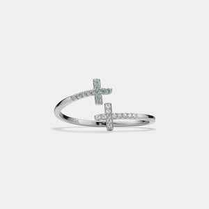 Silver ring with cross designs on a light gray background