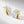 Gold and silver ladybug earrings on a light gray background