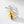 Gold insect-shaped earring with silver leaf design on a white background