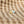 Gold ring with a moon design and opal stone on a beige fabric background