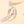 Two silver rings with gold sun and moon accents on a light beige background
