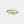 Two-tone ring with a knot design on a light gray background