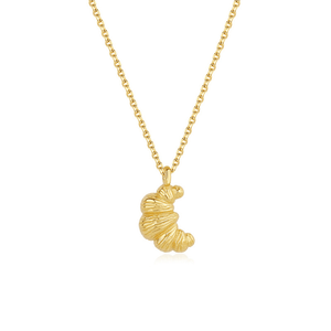 Gold necklace with a unique pendant on a white background