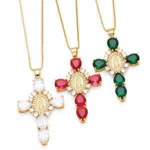 Three gold necklaces with gemstone pendants on a white background