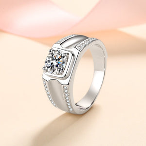 Silver ring with a diamond on a soft pink background