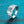 Silver ring with a large diamond on a blue textured background