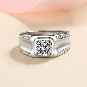 Silver ring with a diamond on a beige background