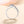 Silver ring with a central gemstone on a light background